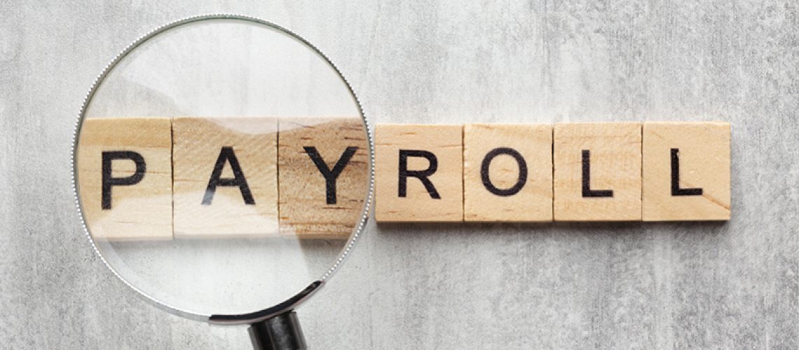 top-view-payroll-concept-with-wooden-cubes